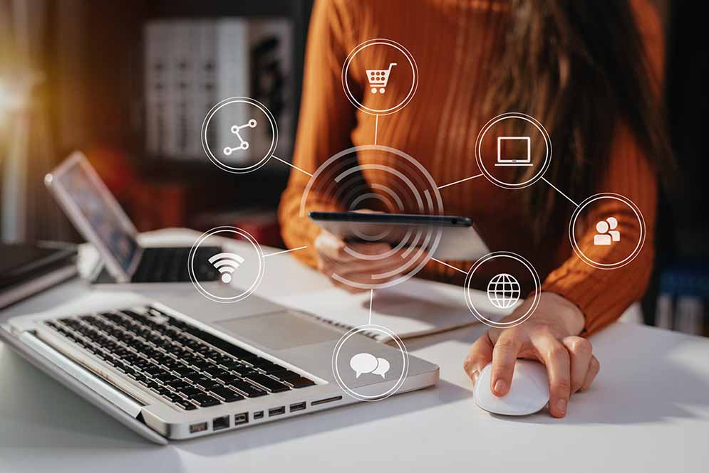 Woman working on tablet screen with website automation floating icons.
