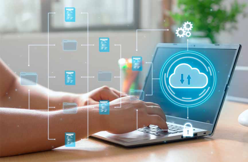 A man utilizes cloud computing technology on his laptop for data transmission, storage, backup, and retrieval