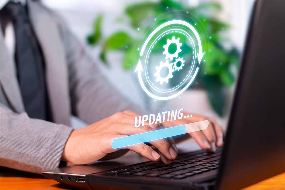 Staying Current: System and plugin updates, man typing on a keyboard
